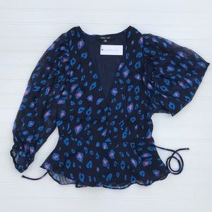 Leopard print balloon sleeve blouse.